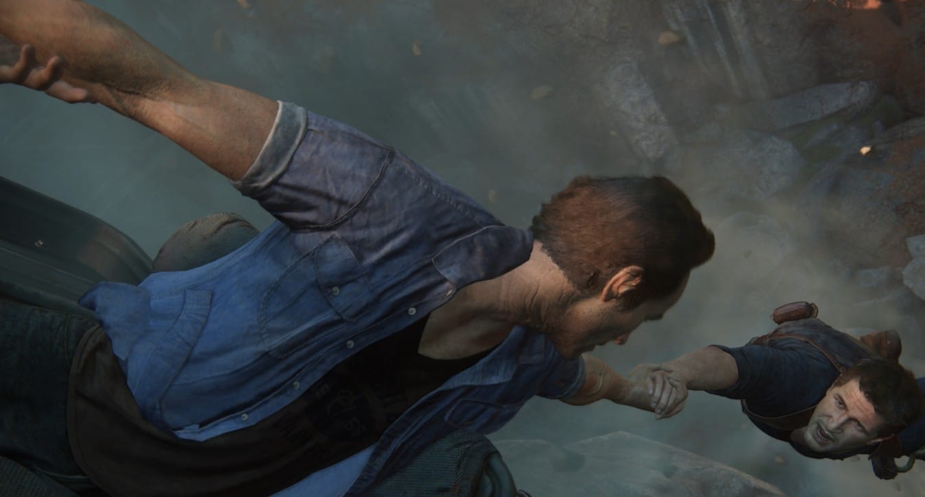 брат держит брата за руку над пропастью Uncharted: Legacy of Thieves Collection