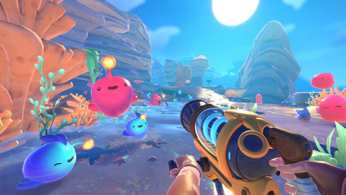 герой наставляет оружие против слаймов Slime Rancher 2