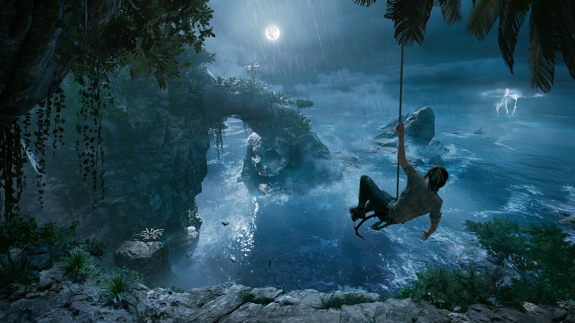Лара висит на веревке над пропастью в Shadow of the Tomb Raider